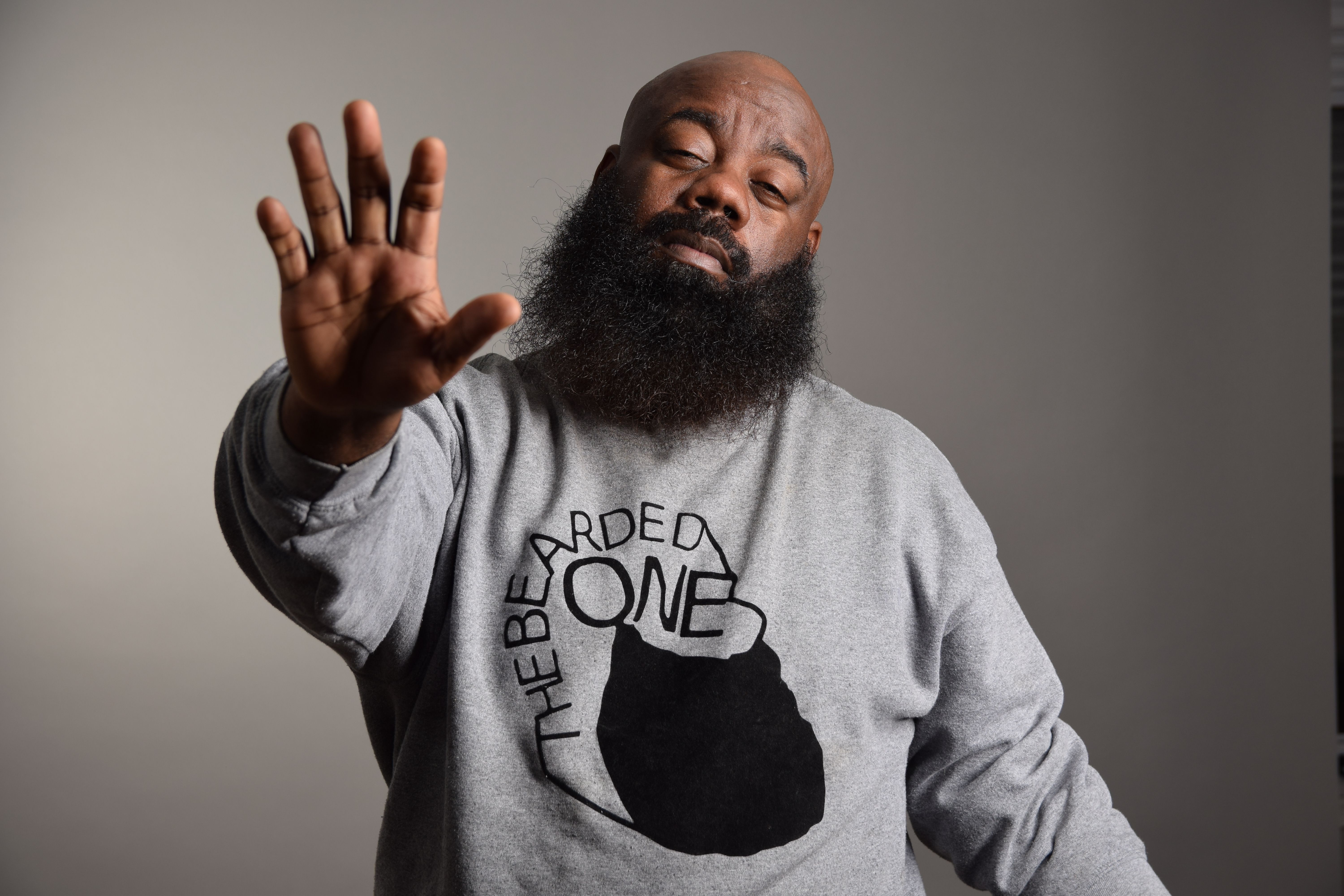 Mel performing stand-up on stage