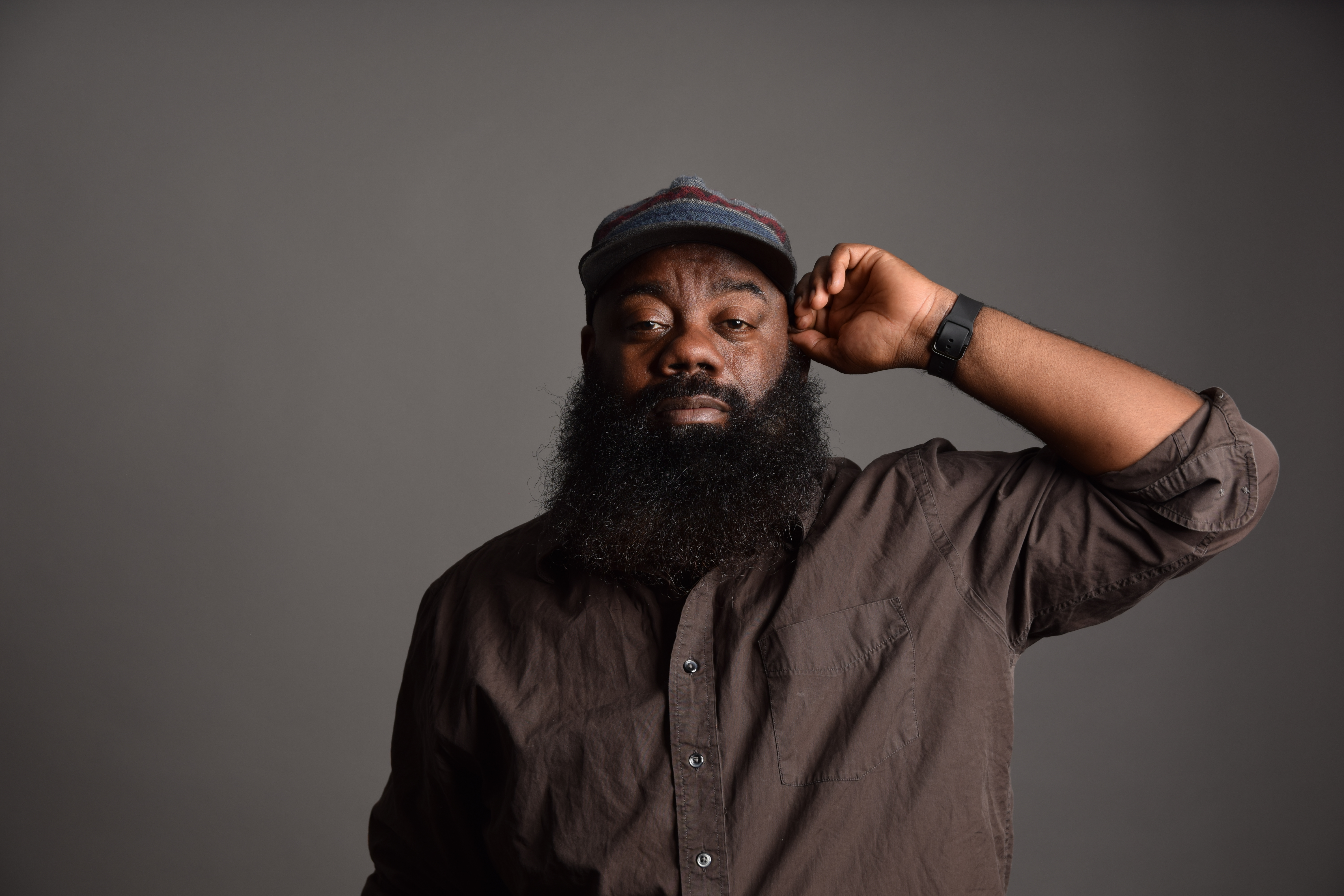 Mel holding a microphone, laughing